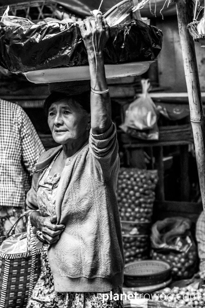 Head carrying through Nyaung U Market, Bagan, Myanmar, 2017
