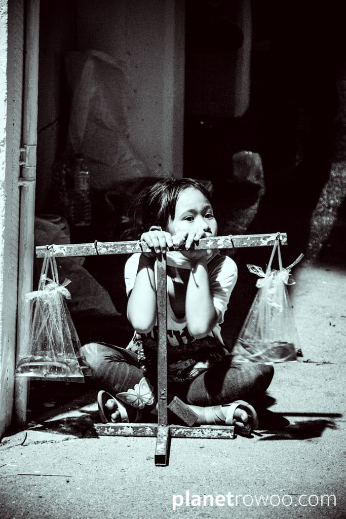 Young girl selling eels, Loy Krathong Festival, Chiang Mai, Northern Thailand⁣⁣⁣⁣, 2020
