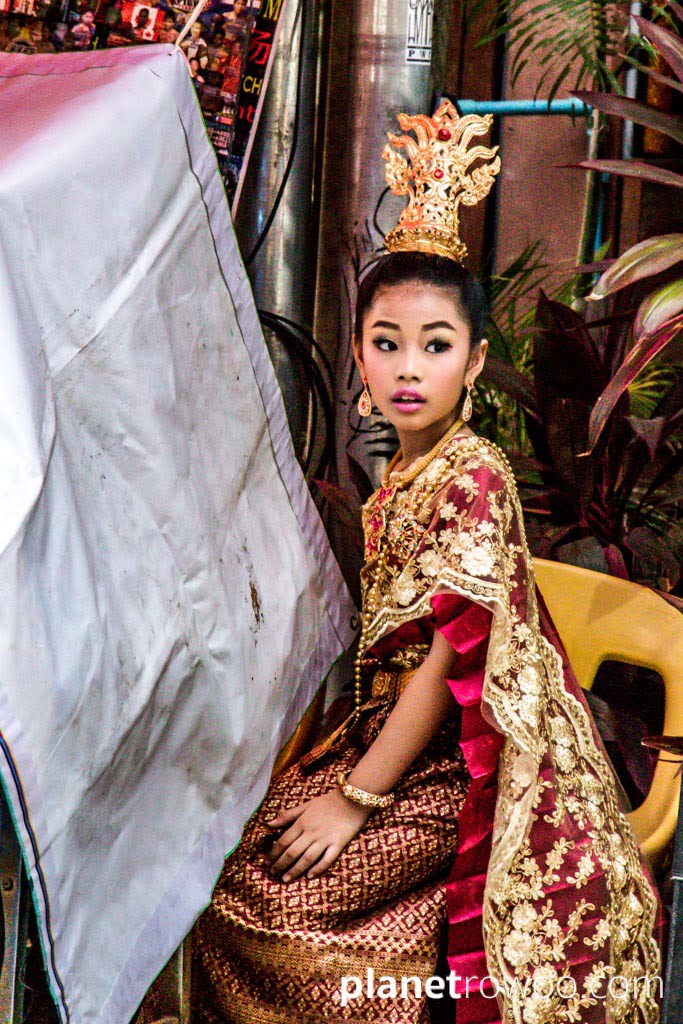 Thai girl in traditional dress for a beauty pageant at the Sunday Walking Street Market, Chiang Mai, Thailand, 2018