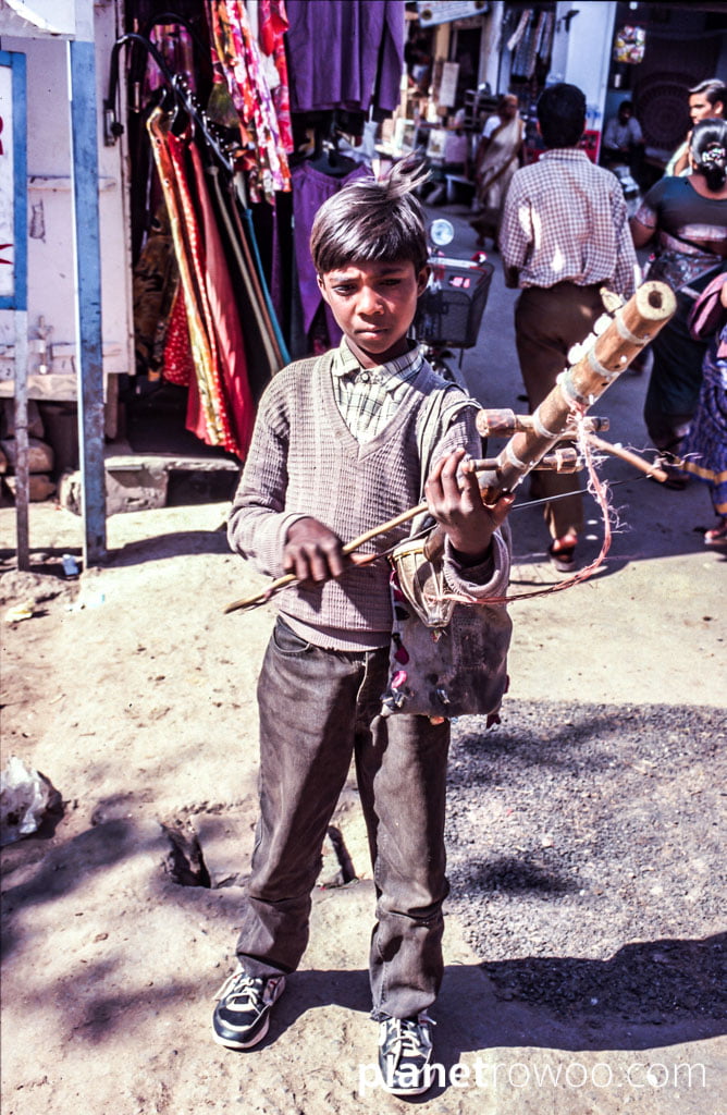 Boy with ravanahatha traditional instrument of Rajasthan, Pushkar, Northern India, 2002 (35mm slide film)