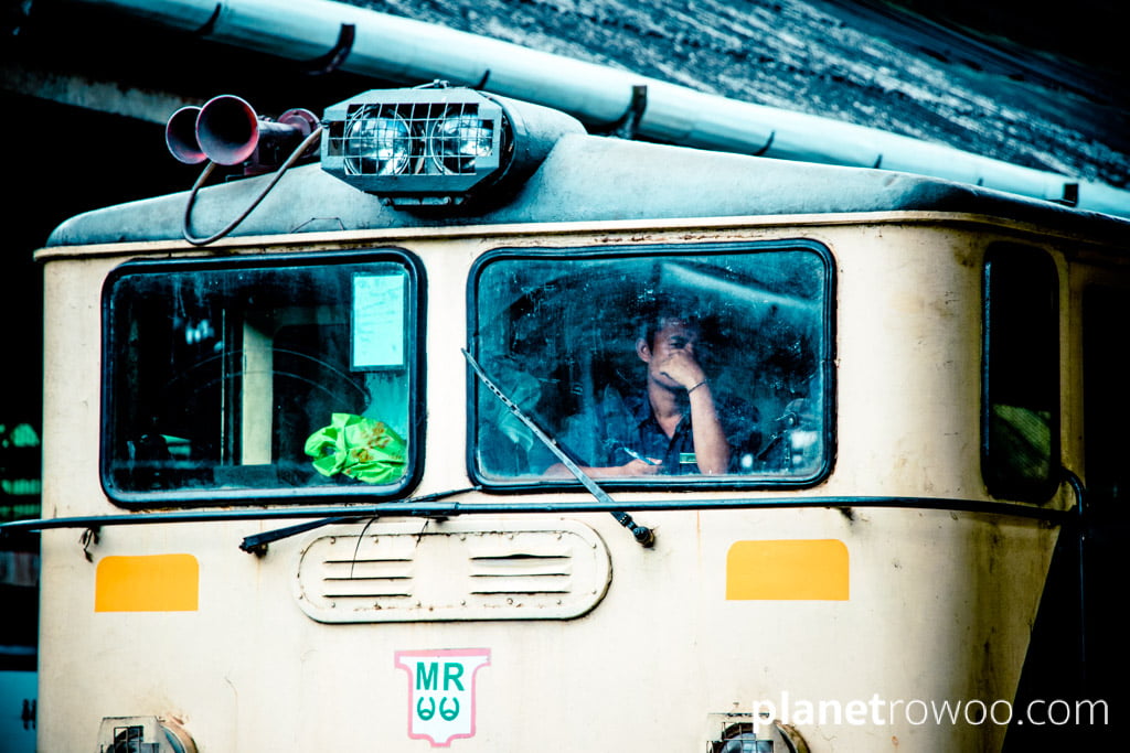 Train driver through windscreen, Yangon Railway Station, Myanmar, 2017
